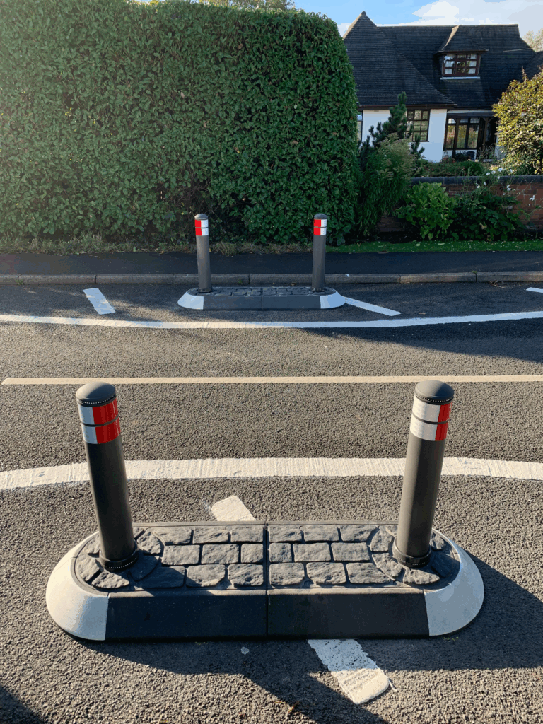 Satellite islands featuring bollards to separate traffic near a residential footway