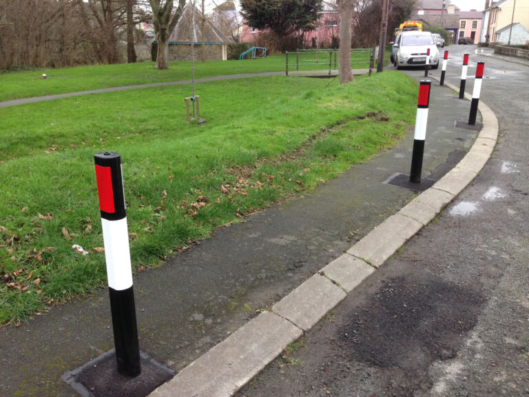 Verge markers installed along the edge of a rural road to delineate the carriageway.
