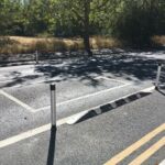 Kerb Orca units with pole cones forming a protected cycle lane on a residential road.