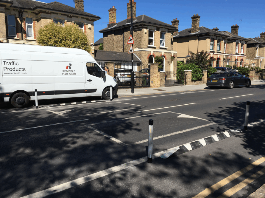 Kerb Orca units with pole cones forming a protected cycle lane on a residential road.