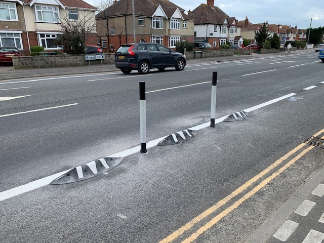 Orca MKII rubber lane divider with zig zag reflective markings and flexible bollards installed on a cycle lane.