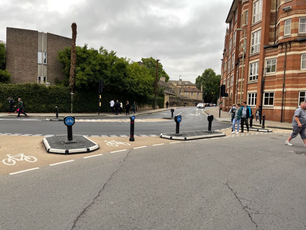 RediPave traffic islands with bollards guiding vehicles and cyclists at a signalised junction