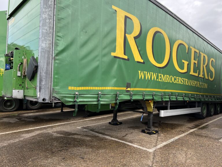 TrailerPad supporting the landing legs of a parked trailer.