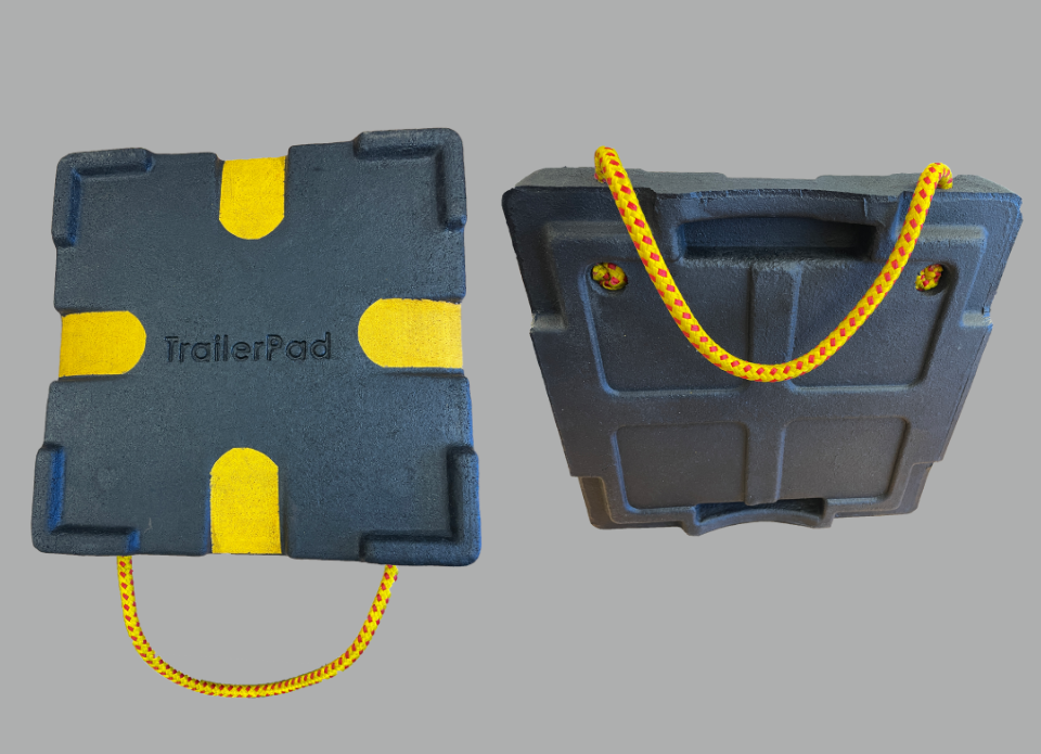 TrailerPad shown from top and underside, featuring high-visibility grip markings and a carry rope.