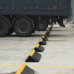TruckStop 150 wheel stops installed in an industrial car park to prevent vehicle overrun.