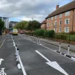 Installed Greenwich Wand Orca cycle lane separator with flexible bollards.