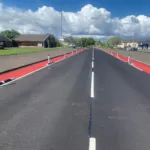 Greenwich Wand Orca installed on a red cycle lane with flexible posts.