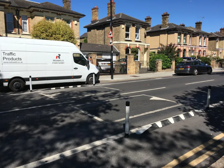 Kerb Orca units with pole cones forming a protected cycle lane on a residential road.
