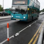 Installed Orca lane separator used to delineate a bus lane on an urban street with flexible bollards.