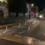 One-piece Wand Orca lane separators installed along a segregated cycle lane at night.