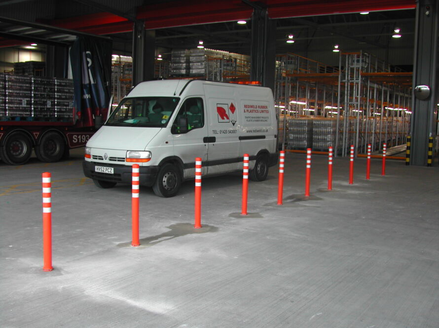 Off-highway pole cones temporarily installed inside a warehouse for demonstration purposes.