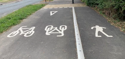 Raised line delineator installed alongside a segregated cycle lane to define the cycling route.