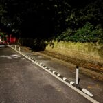 Installed Greenwich Wand Orca cycle lane separator with flexible bollards.