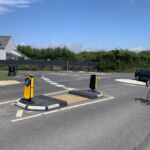 RediPave pedestrian traffic island with RediFix tactile paving and bollards on an urban street