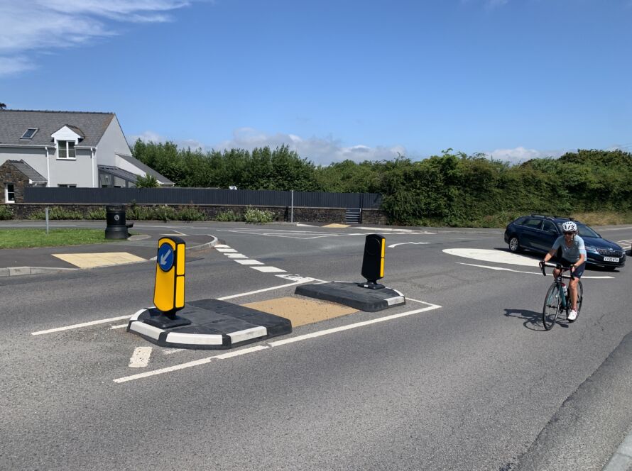 RediPave pedestrian traffic island with RediFix tactile paving and bollards on an urban street