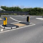 RediPave pedestrian traffic island with RediFix tactile paving and bollards on an urban street