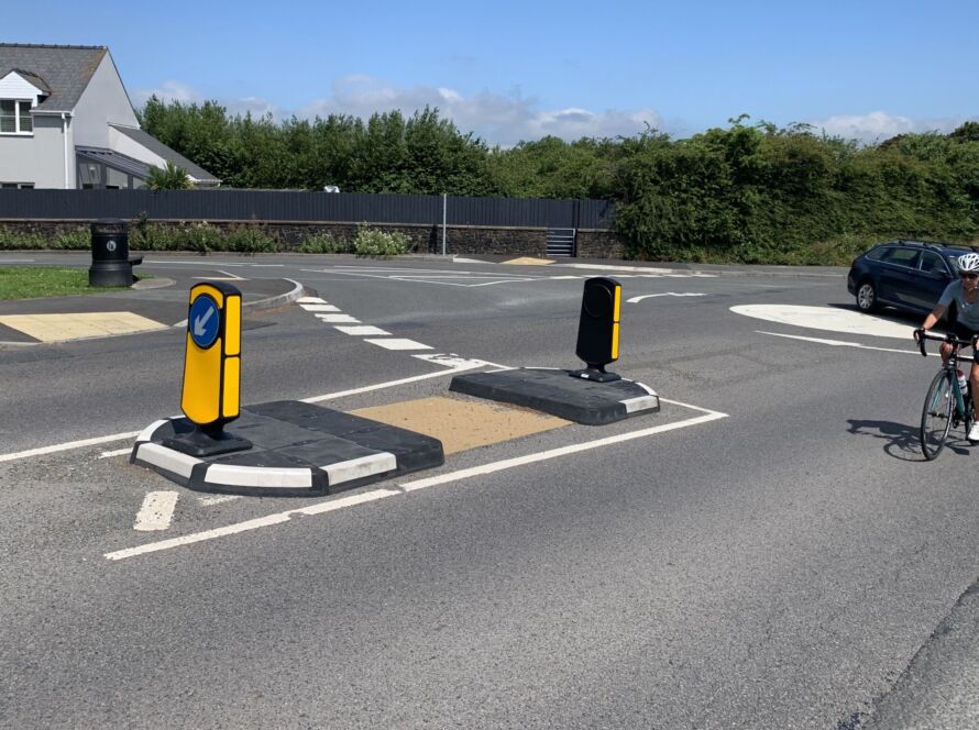 RediPave pedestrian traffic island with RediFix tactile paving and bollards on an urban street