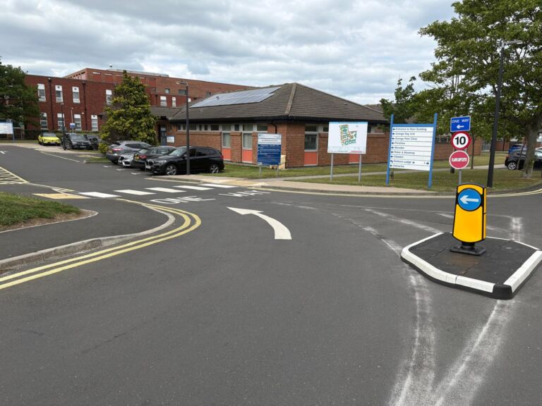 RediPave modular traffic island with keep-left bollard at a site access junction.