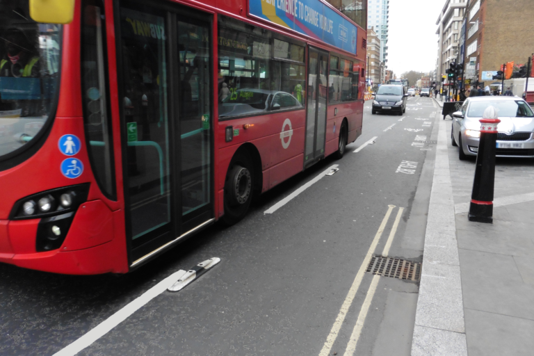 Installed Mini Orca lane separator used to delineate a bus lane on an urban street.