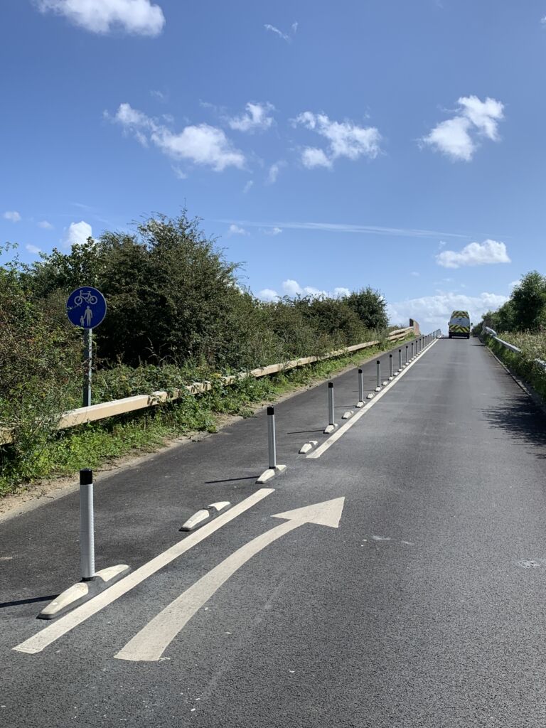 One Piece Wand Orca units with flexible wands installed along a segregated cycle lane on an urban road.
