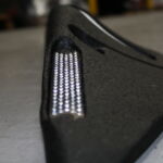 Orca MKII rubber lane divider with zig zag design, recessed white reflective markings, and integrated reflective beading.