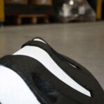 Orca MKII rubber lane divider with zig zag design and recessed white reflective markings.