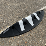 Orca MKII rubber lane divider with zig zag design, recessed white reflective markings, and integrated reflective beading.