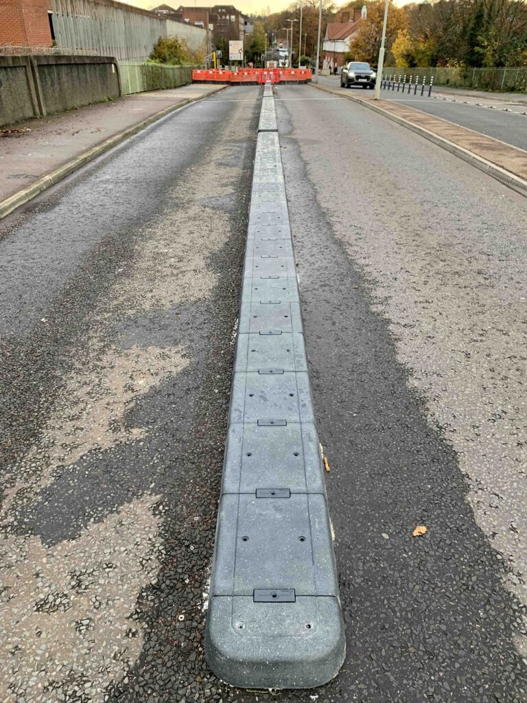 500 mm RediPave splitter installed along the centre of a bridge carriageway to segregate traffic lanes and improve road safety