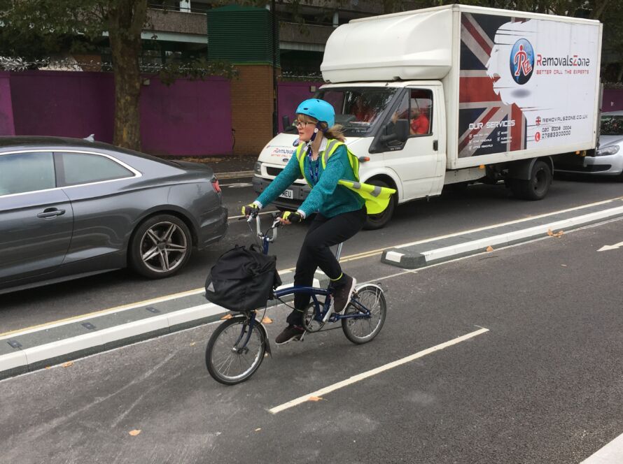 Cyclist using a segregated cycle lane formed by 500 mm splitter islands