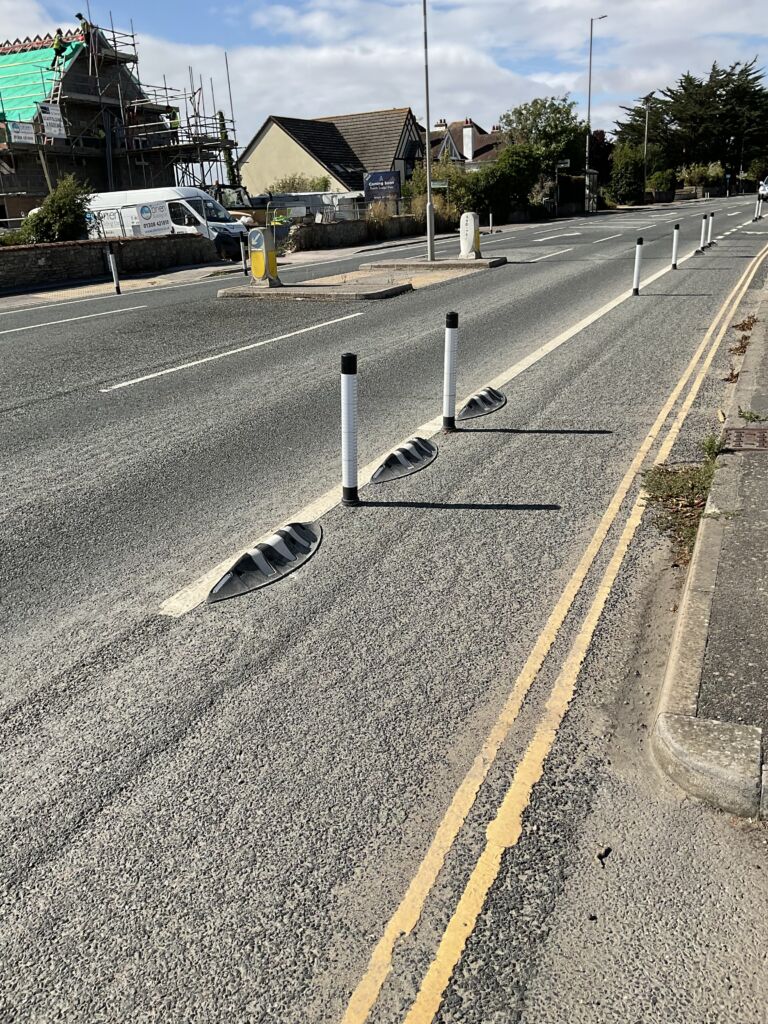 Orca MKII rubber lane divider with zig zag reflective markings and flexible bollards installed on a cycle lane.