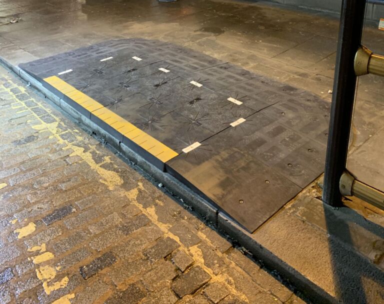 BusPad installed at a bus stop to create a level boarding area