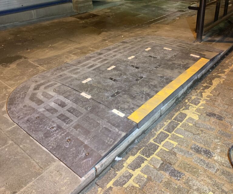 BusPad installed at a bus stop to create a level boarding area.