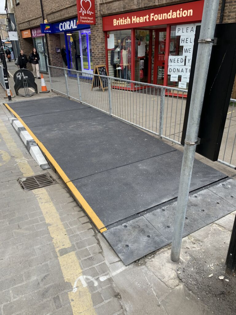 Modular bus ramp installed at the kerb to provide step-free access between the road and footway.