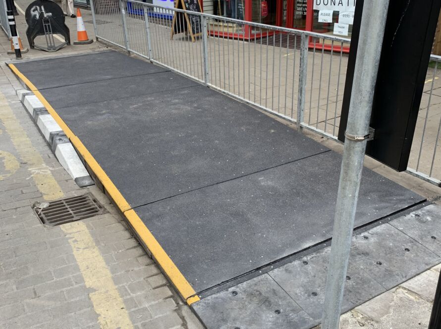 Modular bus ramp installed at the kerb to provide step-free access between the road and footway.