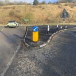 RediKerb half-battered (HB) kerbing installed to form a traffic island, guiding and controlling vehicle movements with a keep-left bollard and verge markers.