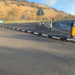 RediKerb half-battered (HB) kerbing installed to form a traffic island, guiding and controlling vehicle movements with a keep-left bollard and verge markers.