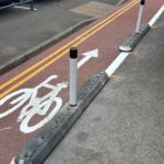 Milestone traffic islands with reflective bollards installed to segregate traffic