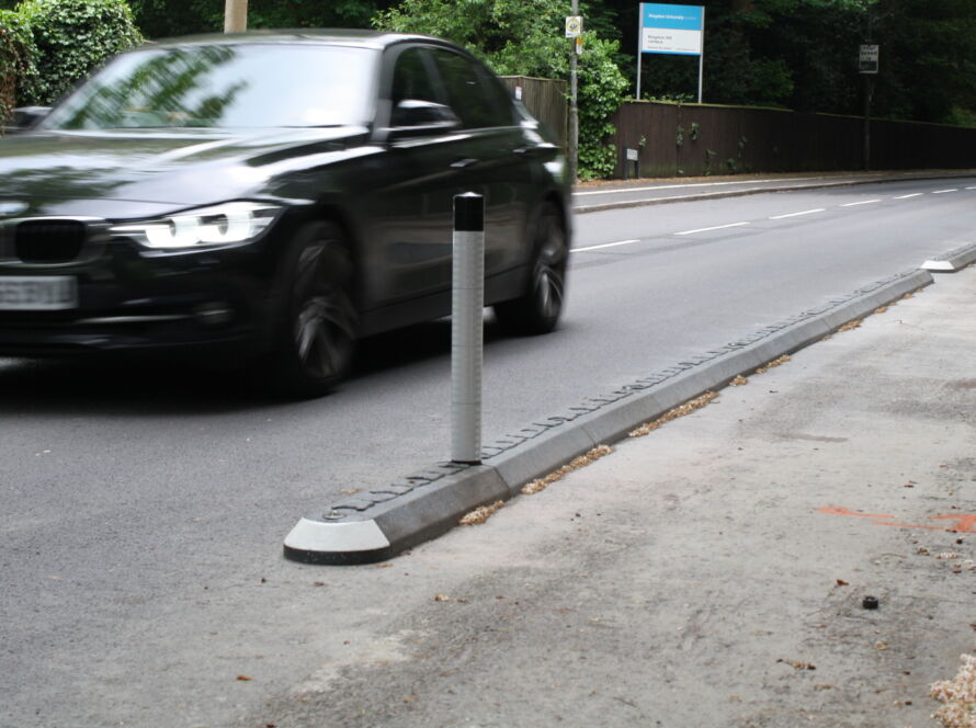 Milestone traffic island with reflective bollard installed to segregate traffic