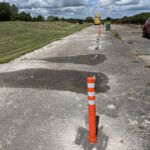Off-highway pole cone installed on a concrete surface for demonstration purposes