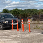 Vehicle contacting off-highway pole cone during impact testing