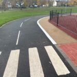 Raised line delineator installed alongside a segregated cycle lane to define the cycling route.