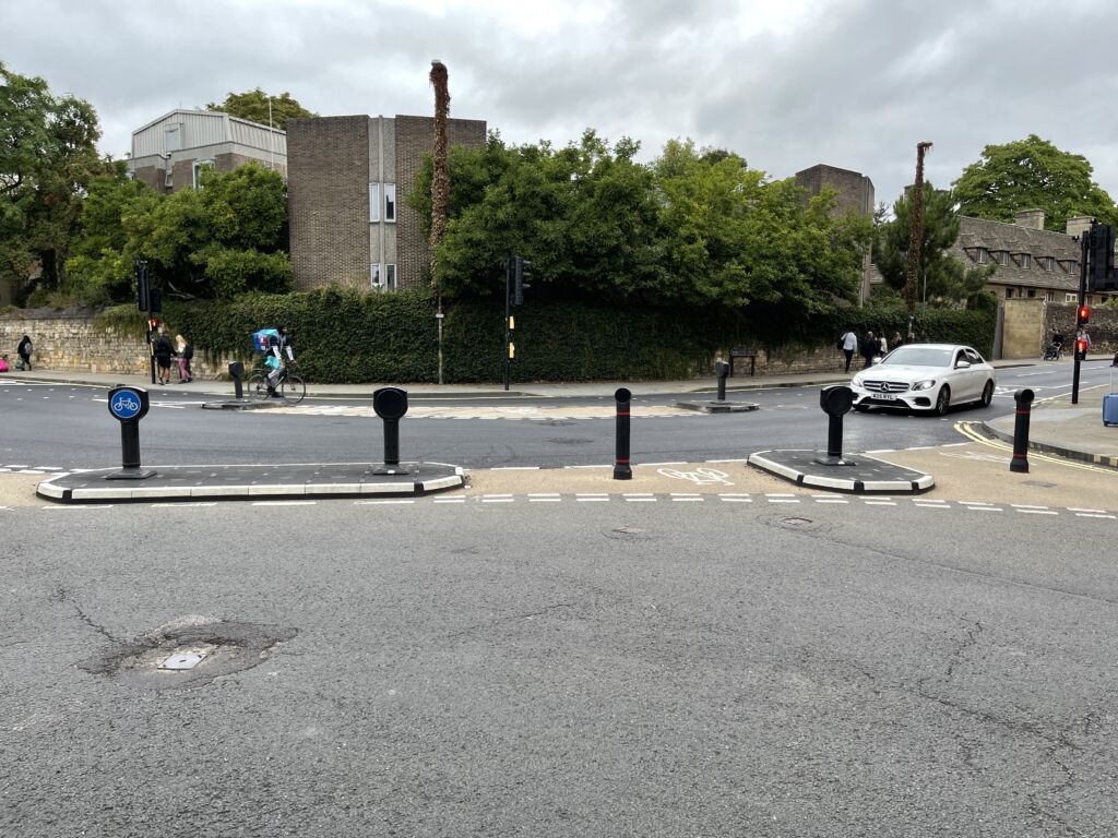 RediPave traffic islands with bollards guiding vehicles and cyclists at a signalised junction