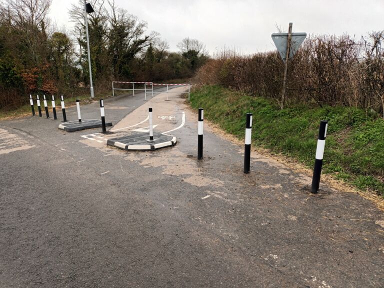 RediPave modular traffic islands forming a cycle chicane, combined with verge marker posts for edge delineation and vehicle exclusion.