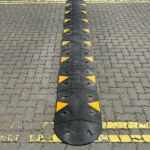 Sitecop modular speed ramp with high-visibility markings installed on a residential road for traffic calming.