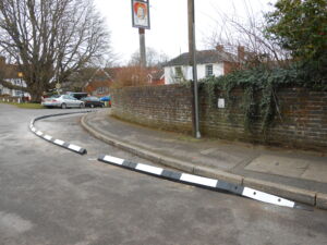 Splayed face (SP) RediKerb kerbing installed along a curved residential road junction.